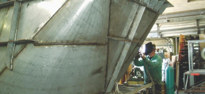 A veteran works at Ernest J. Menold’s sheet metal business. Photo courtesy of Ernest J. Menold.