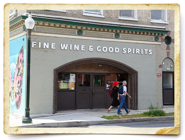 Aug. 5, 2022:  A man and woman are seen walking past a state-owned Fine Wine & Good Spirits store in the Midtown neighborhood of Harrisburg.