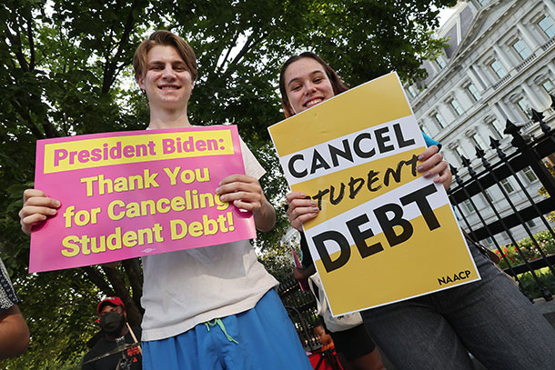 Student loan borrowers celebrate President Joe Biden canceling student debt in front of the White House in August.