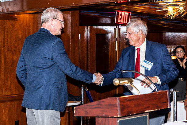 Paul Steinke of The Preservation Alliance of Greater Philadelphia shakes the hand of Paul Levy, his longtime friend and CEO of Center City District