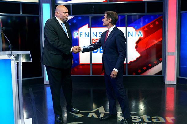 John Fetterman and Dr. Mehmet Oz shaking hands during their U.S. Senate debate.