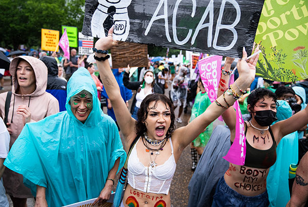 Demonstrators march along Pennsylvania Avenue towards the White House after the overturning of Roe v. Wade.