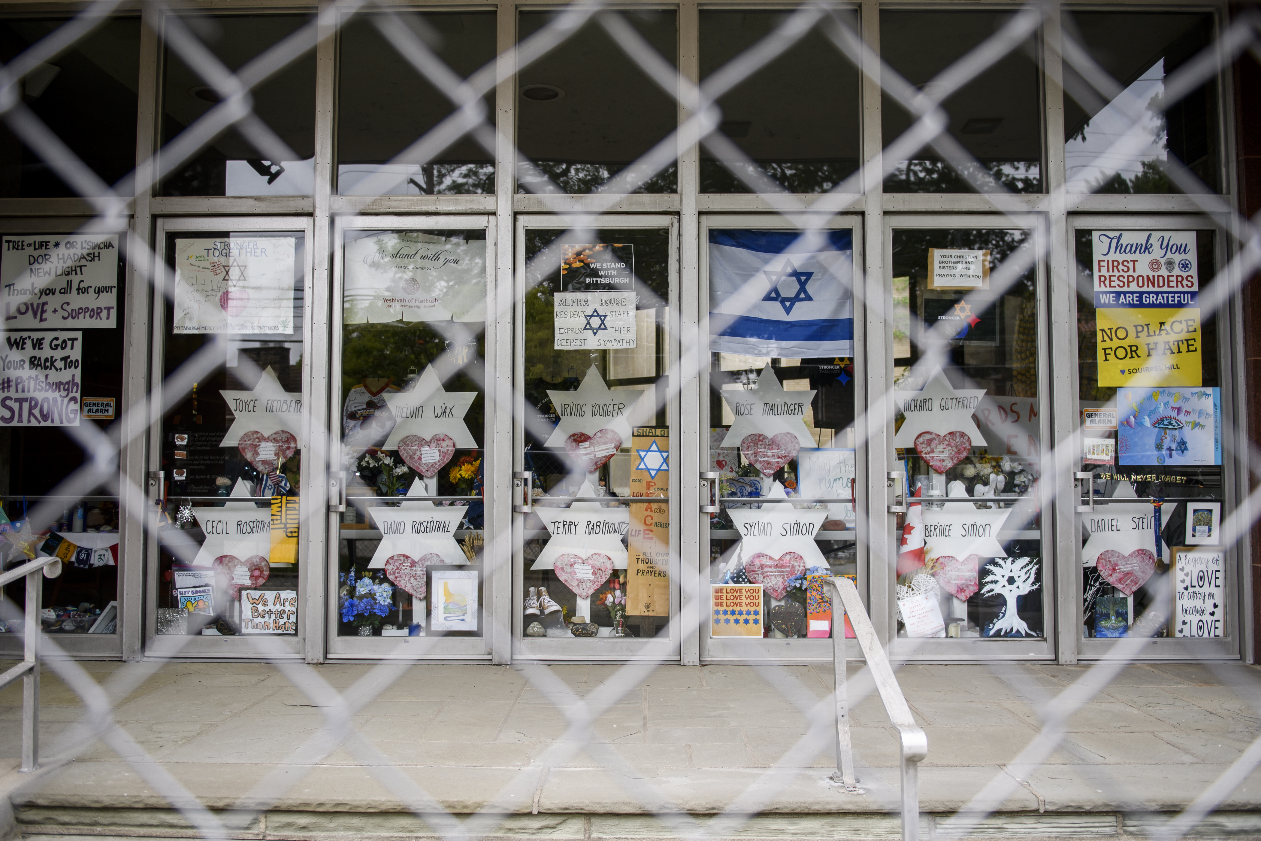 Signs and memorial wishes on the doors of the Tree of Life synagogue in Pittsburgh.