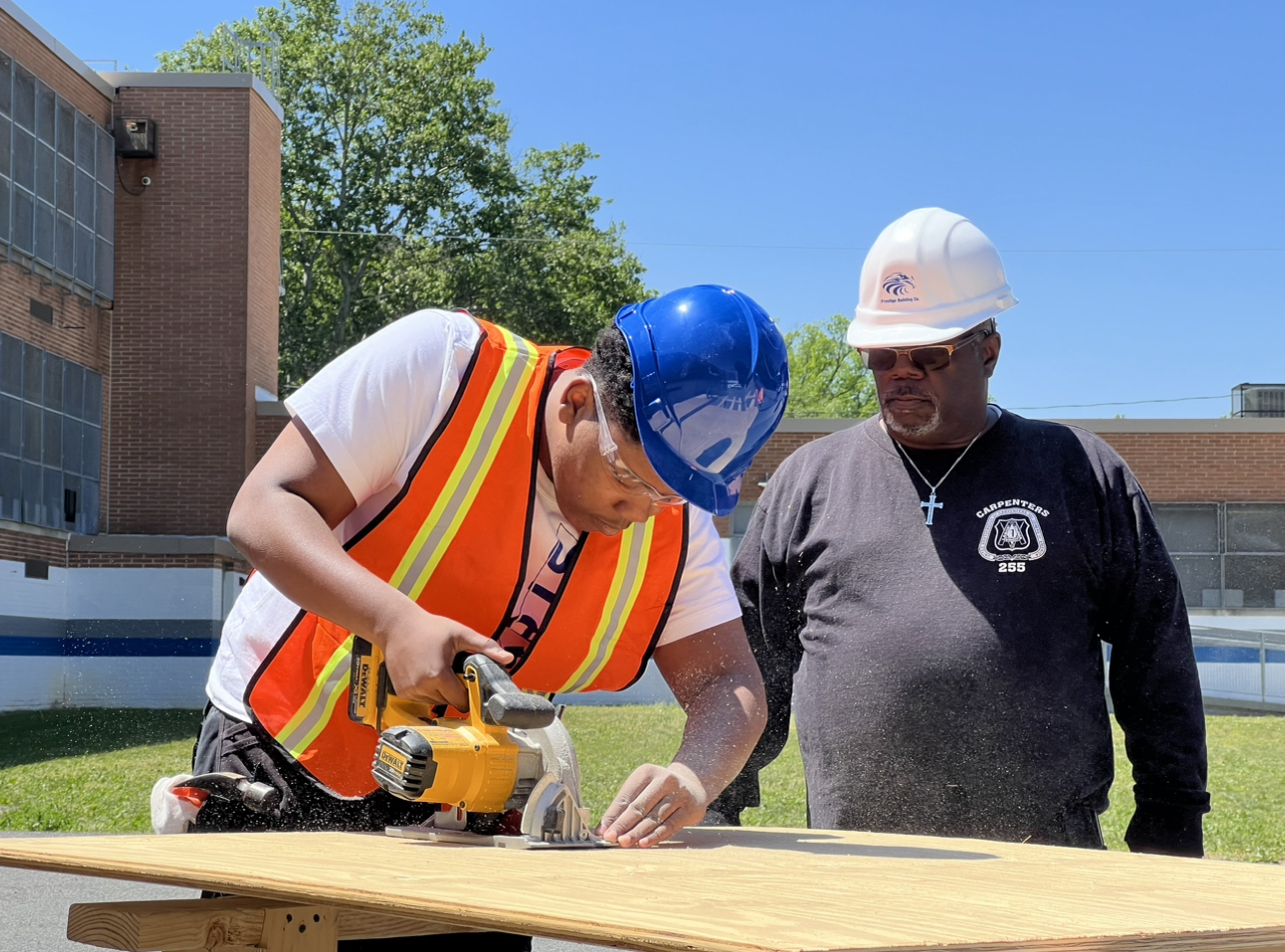 An apprentice trains al fresco in an Eastern Atlantic States Regional Council of Carpenters program.