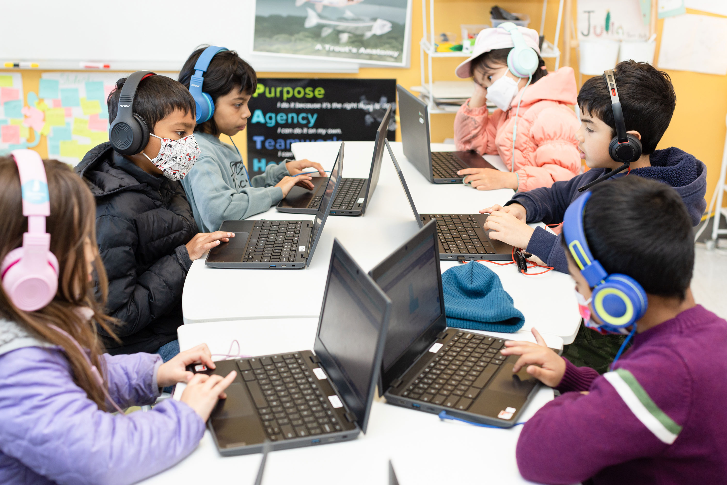 Children work on a classroom exercise using Khanmigo, an AI-powered guide developed by Khan Academy, during a math and sciences class at Khan Lab School.