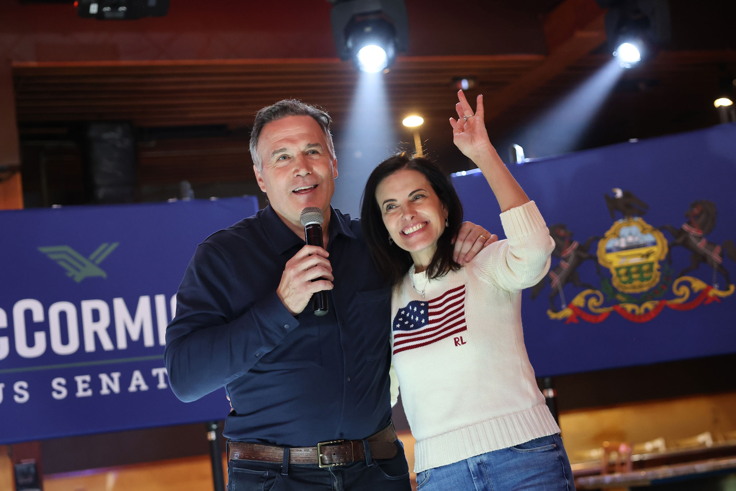 Then-candidate Dave McCormick hugs his wife Dina Powell McCormick as he speaks during a campaign event in November 2024.