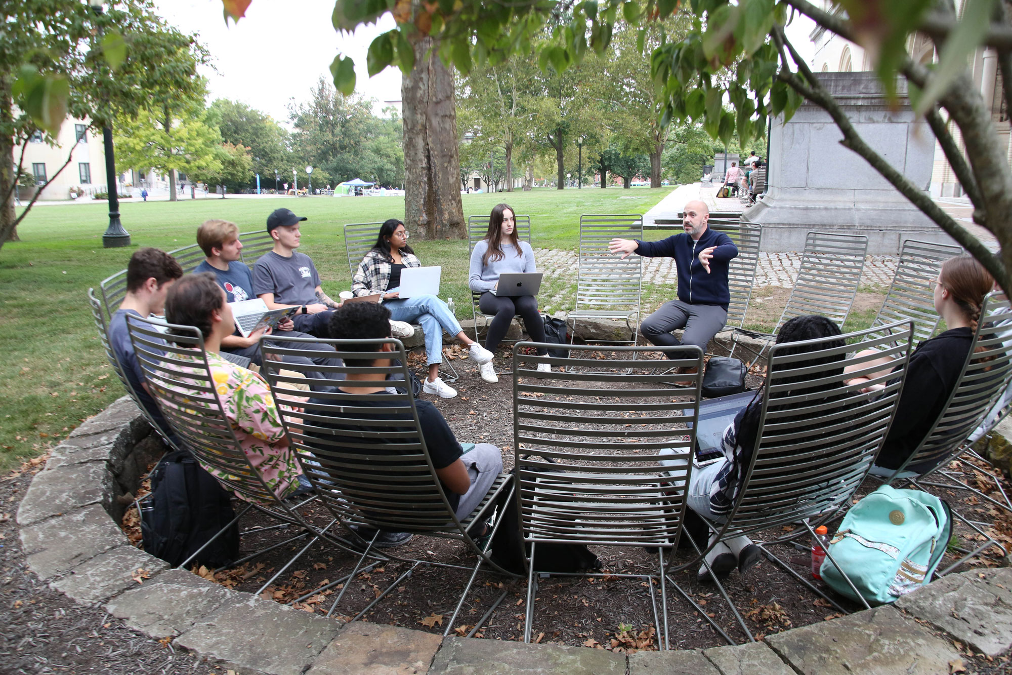 Jonathan Cervas speaks to a class outside at Carnegie Mellon University.
