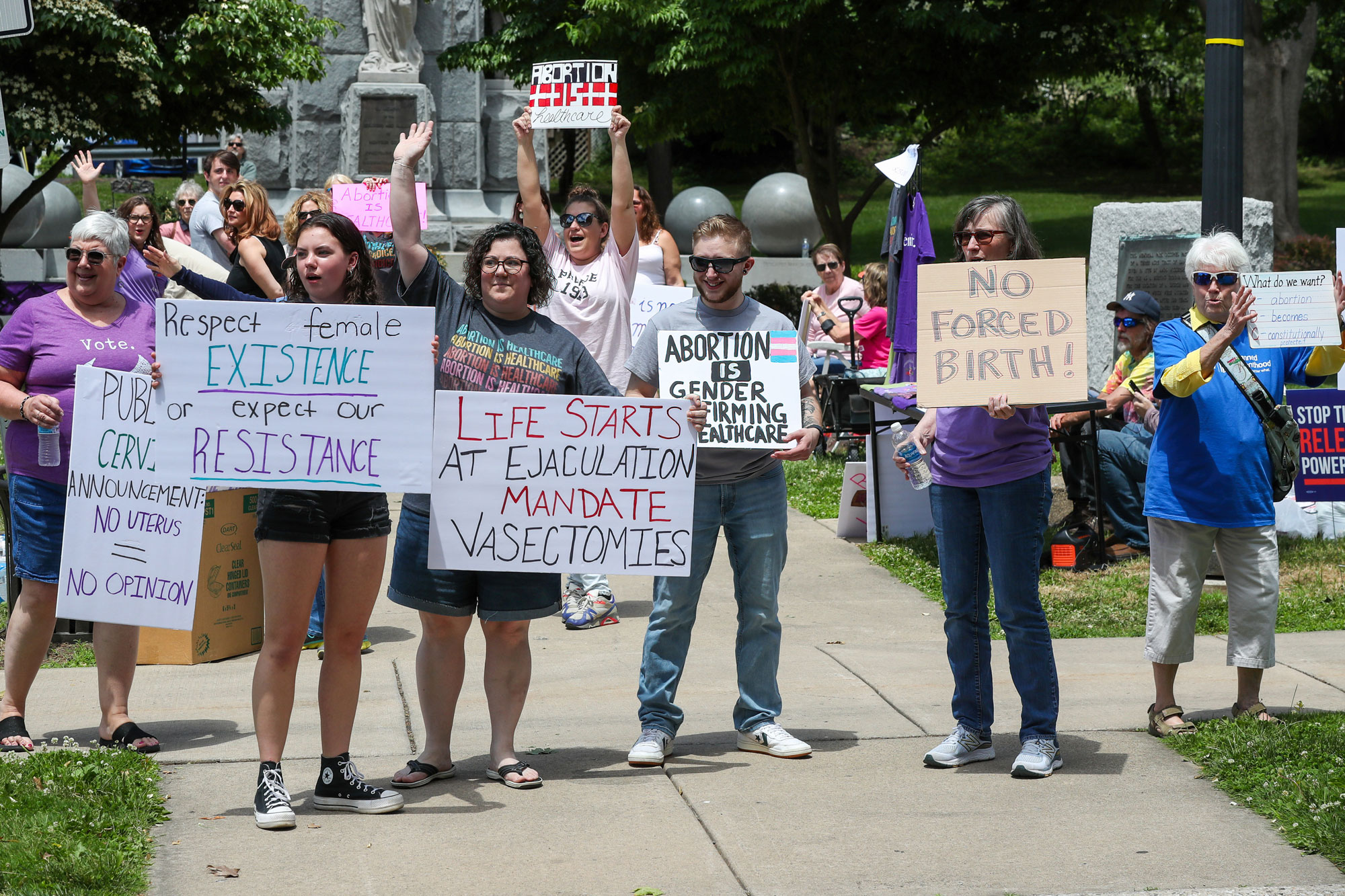 Protesters hold signs advocating for abortion rights at Memorial Park in Danville, Pennsylvania.