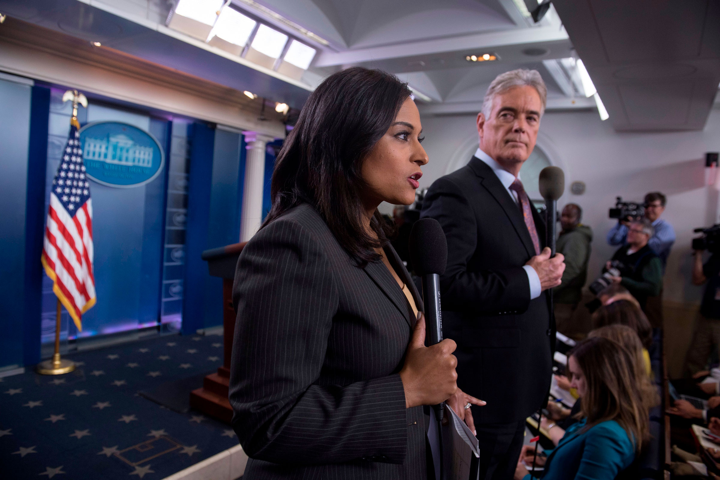 Welker speaking on camera before a White House press briefing as Fox’s John Roberts looks on in 2017.