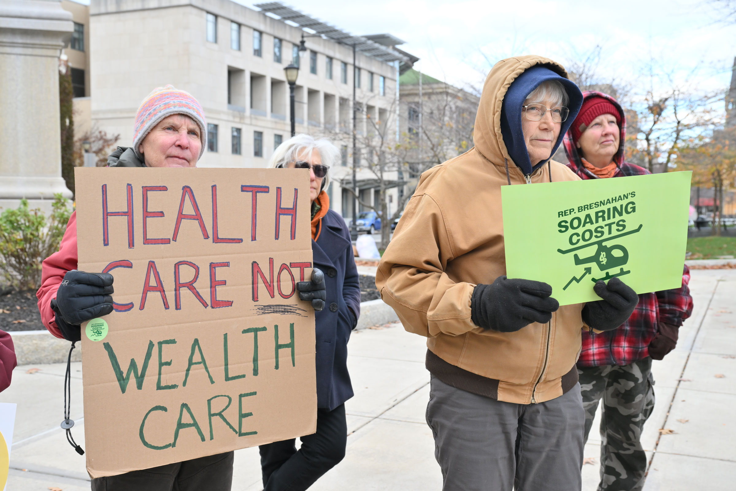 Protestors hold signs directed at Bresnahan at the Lackawanna County Courthouse.