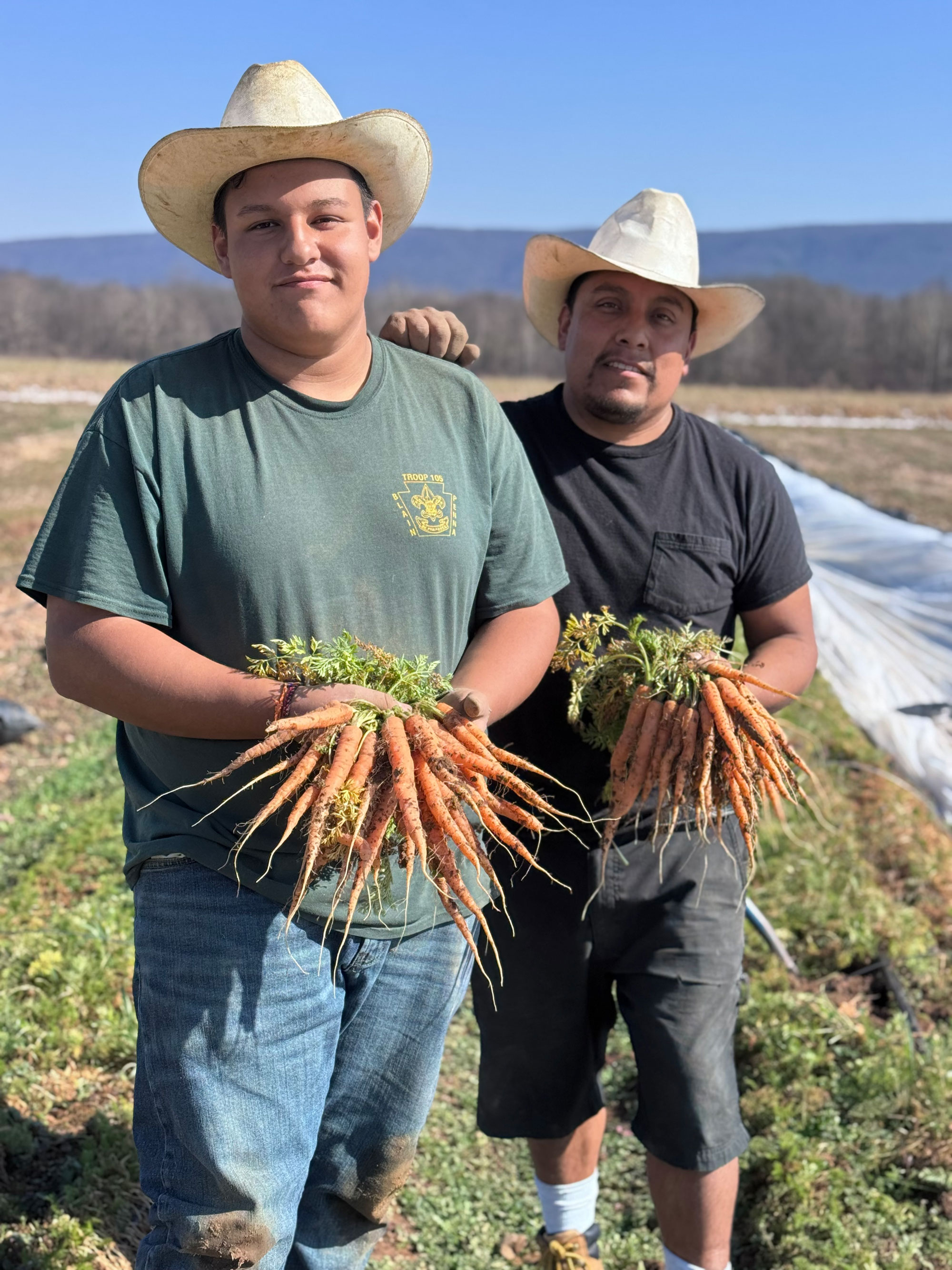 Agustin Salazar Cernas and his son, Austin, on their Perry County farm.