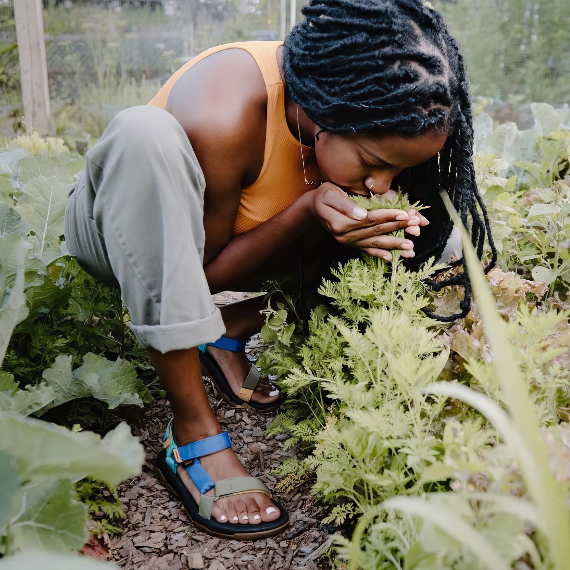 Christa Barfield, who runs FarmerJawn in Southeastern Pennsylvania, examines her crops.