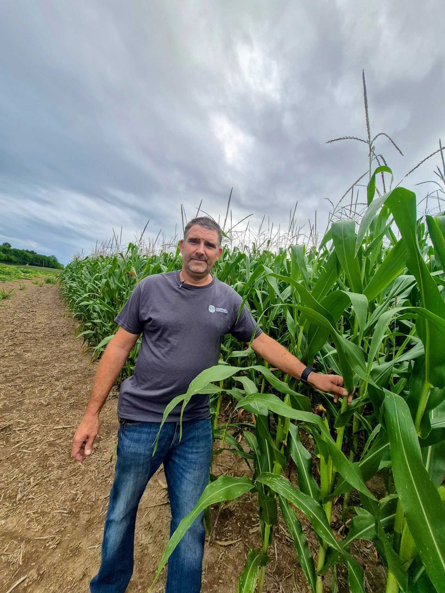Mike Reskovac, shown with this year’s corn crop, spent $15,000 more on fuel and fertilizer this year.