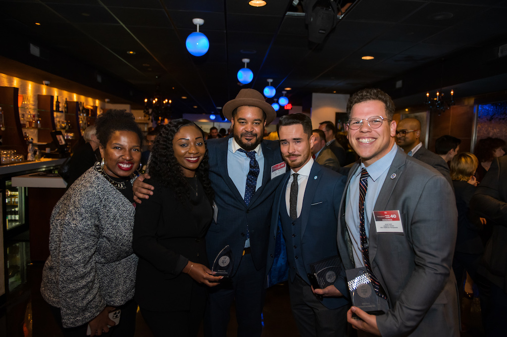 Forty Under 40 honorees Teresa Lundy, John Brady and Jarrett Smith pose with supporters