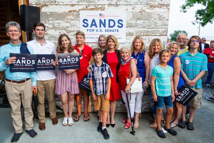Sands poses with supporters of her campaign for U.S. senator.