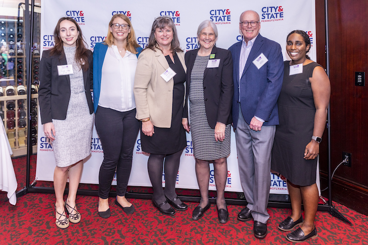Honoree Susan Gobreski, third from left, and honoree Carol Kuniholm, fourth from left, celebrate with family and colleagues.