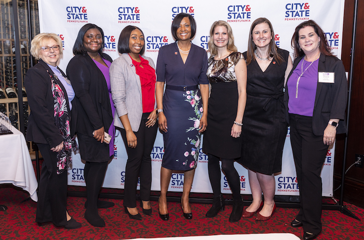 Honoree Glennis Harris poses with friends and colleagues from GIANT.