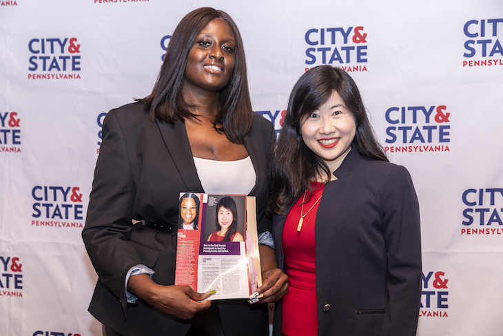 Zarinah Lomax, host of the Zarinah Lomax Show on Instagram, (left) and Stephanie Sun, of Governor’s Advisory Commission on Asian Pacific American Affairs, (right) show off a copy of City & State PA magazine.