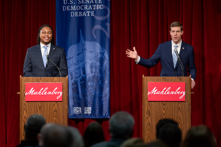 U.S. Rep. Conor Lamb gestures towards state Rep. Malcolm Kenyatta