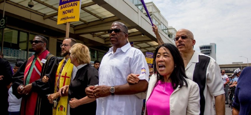 Demonstrators rally at the Philadelphia International Airport during contract negotiations with American Airlines subcontractors in 2017.