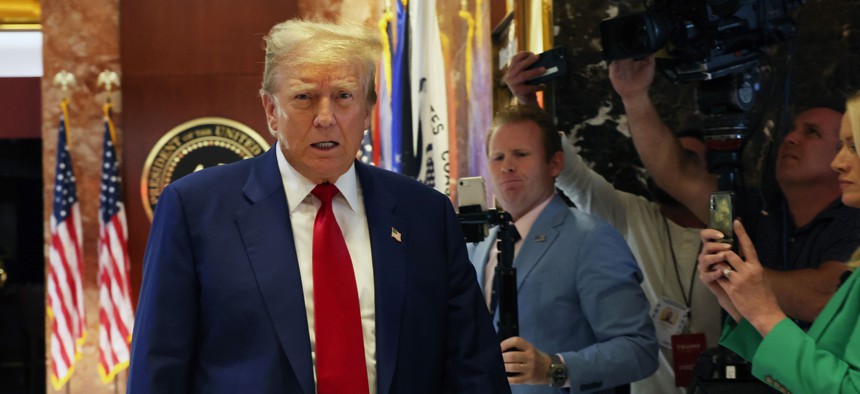 Former U.S. President Donald Trump enters a news conference at Trump Tower in New York City following the verdict in his hush-money trial.