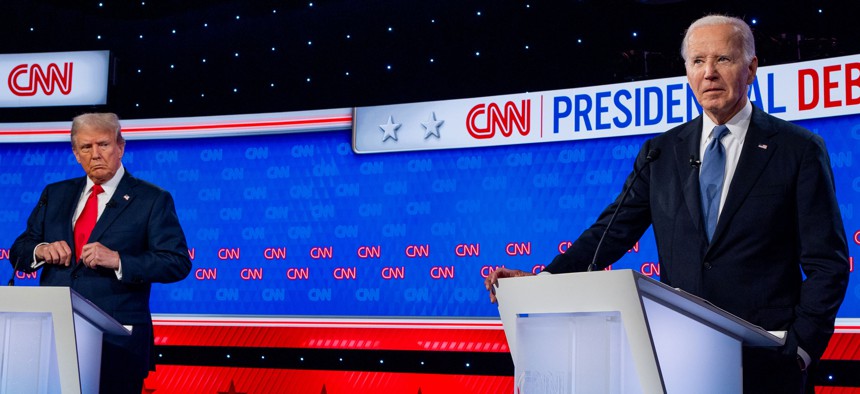 Republican presidential candidate, former President Donald Trump (L) looks at U.S. President Joe Biden during the CNN Presidential Debate Thursday night